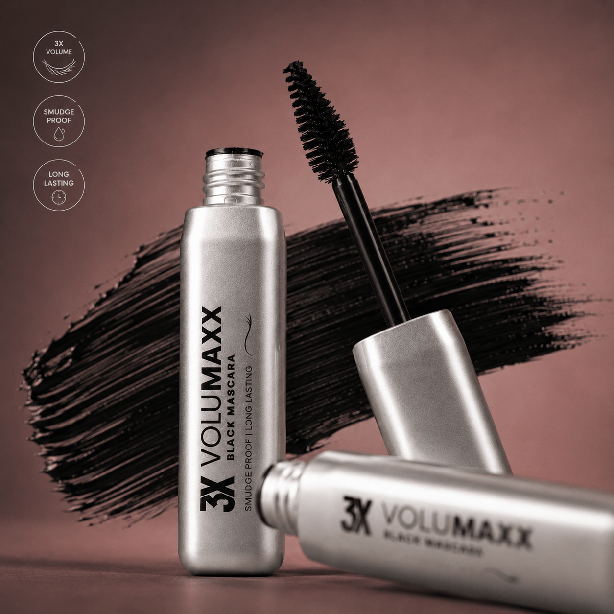 3X Volumaxx volumizing mascara bottles with a brush on a brown background